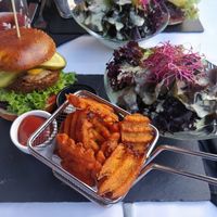 Forrest Gump Burger with sweet potato fries and a salad at Samses in Zurich