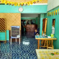 Seating and Kitchen area at Sankhongnoi Veggie in Chiang Rai
