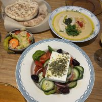 Classic Hummus with pita bread & Greek Salad (not vegan contains dairy)  at La Hummuseria in Madrid