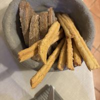 Bread basket (half attacked already lol)  at Mezzaluna in Turin