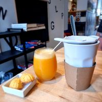 fresh juice and tea - note side cookies not vegan at Books & Brunch in Bruges