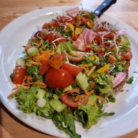 toast with mashed avocado and vegetables at Books & Brunch in Bruges