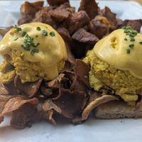 vegan tofu eggs Benedict with mushroom bacon and breakfast potatoes at Front Street Cafe in Philadelphia