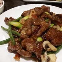 Crispy seitan orange chicken with fresh vegetables and brown rice at Green Zenphony in Rego Park