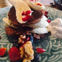 Vegan cacao, vanilla and buckwheat pancakes (with a side of coconut yogurt, cause the standard sauce was too rich for me!).  at Betty's Bohemian Beach Cafe in Port Douglas