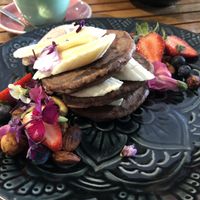 Buckwheat Pancakes with Cacao, Vanilla & Fresh Berries, Banana and Granola at Betty's Bohemian Beach Cafe in Port Douglas