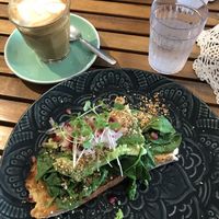 Avocado toast and soy latte at Betty's Bohemian Beach Cafe in Port Douglas