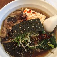 vegan ramen with added hot oil and sesame seeds at Fou Fow Ramen in Amsterdam