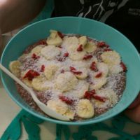 vegan porridge with coco, banana, coconut and goji berries  at Milk Away in Sevilla