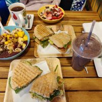 Açai bowl, porridge, smoothie (with ingredients I chose) and paninis at Milk Away in Sevilla