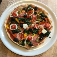 Pizza with veggies and vegan bacon! at Yummies in Hamburg