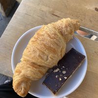 Vegan Croissant ( extremely delicious) and sniters (chocolate caramel peanut bar) at Two Planets in Berlin