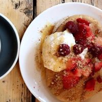Vegan pancakes with coconut yoghurt, maple syrup, berries and a pecan crumble at Yogism - George's Street Arcade in Dublin