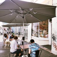 A couple of outdoor tables at Trang Bakery and Cafe in Collingwood