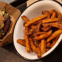 Vegan chili cheeze burger with sweet potato fries and truffle vegan mayo dip at Swing Kitchen - Operngasse in Vienna