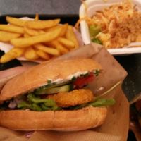 Vegan chicken burger with chips and coleslaw at Swing Kitchen - Operngasse in Vienna