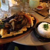 Flame grilled eggplant and onion on a bed of fried potato with a side of rice. A bit oily, but delicious!
Also in the picture is the bottom of the lime and mint frappe. Very refreshing! at ExotiK in Newtown