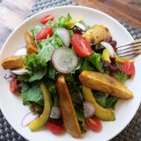 Jalus garden salad with sweet potato wedges
 at Jalus Vegan Kitchen in Hanoi