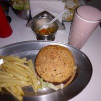 Hamburger (lentils and seeds) fries and yogurt milkshake. at Govinda Ram in Mexico City