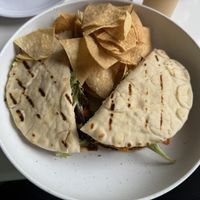 Veggie burger on pita with freshly made tortilla chips.  at Pure Fresh Food and Juice Bar in San Juan