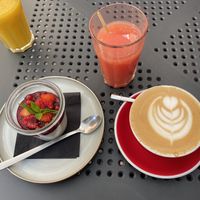 Tapioca Pudding, grapefruit juice and oat milk latte. at Wesola Cafe in Krakow