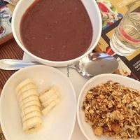 acai bowl with acai smoothie, homemade granola and fresh banana at cacao in Prague