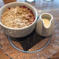 crumble of the day (rasberry) with home made custard  at Mildreds - Camden in North West London