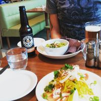 Super spicy ?coconut papaya chili lime raw vegan salad, guacamole with blue corn chips and this Goldeneye Pale Ale for him. at Mildreds - Camden in North West London
