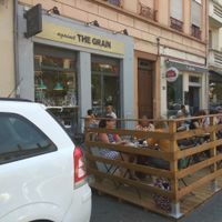 Shop front and outdoor seating at Against the Grain in Lyon