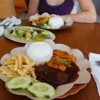 chicken steak in front, vegetables and other chicken variation at Lusidus in Yogyakarta