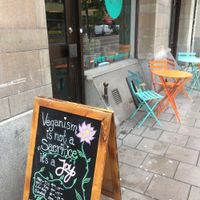 Outdoor seating (in chilly October!) and a beautiful sign  at Mahalo - Hornsgatan in Stockholm