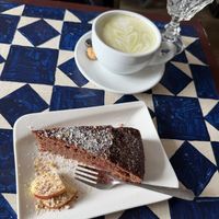Chocolate raspberry cake with a matcha lattee  at GustaV in Salzburg