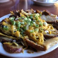 Veggie potatoes with Ciao cheese and field roast sausage  at Blue Star Cafe & Pub in Seattle