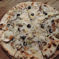 White pizza deluxe with olives (vegetarian!) at By Hand Cafe in Chiang Mai