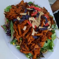 Buffalo soy curl salad, crazy good, there's vegan ranch, corn & avocado & lots of greens under there at Homegrown Smoker in Portland