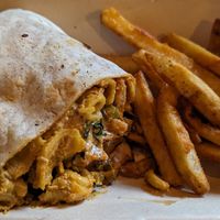 half of a Buff Burrito with some fries at Homegrown Smoker in Portland