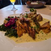 Seitan with vegan bernaise, hasselback potatoes, and kale and lingonberries salad at Blackbird in Gothenburg