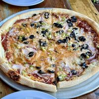Build your own pizza at LFK with red sauce, vegan cheese, black olives, green peppers, and red onions. Excellent!  at LFK in Portland