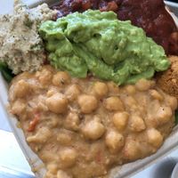 super hero sampler with tomato chickpea, avo mash, bean chili, falafel, veggie tuna on a bed of spinach and quinoa. soo big and filling!  at Plant Wise in Dix Hills