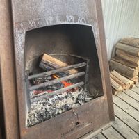 Open fireplace next to outdoor seating   at Wild Thyme Cafe in Bright