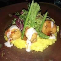 Zucchini tofu balls on a bed of mashed cassava  at Moksa in Ubud