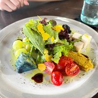 Cheese Platter - served with living crackers, grapes, baby tomatoes, and organic greens. at Moksa in Ubud