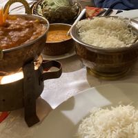 Yummy vegan cauliflower and potato stew served with rice (lamb and another sauce in the background). at Namaste Nepal in Chemnitz