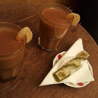 Vegan chai tea and vegetarian sweet at Caj Chai Teahouse in Barcelona