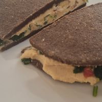 Sandwich 3 raw protein bread, sprouted chickpeas, hummas, dried tomato, wild rocket at Ecru in Rome