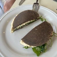 Hummus, arugula, sun dried tomatoes, and raw bread !!! Yum !!!!  at Ecru in Rome