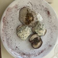 Stuffed mushrooms. The just seasoned ones were delicious, the filling in the other two was okay.  at Ecru in Rome