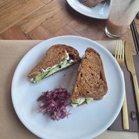The dish of the day, a fantastic sandwich with caramalized onions, zucchini carpaccio and their homemade burger with cashew sour cream.. What a flavorbomb! at Ecru in Rome