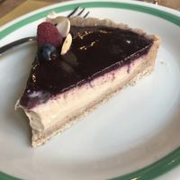 Delicious dessert!  Almond crust, cashew cream Center with blueberry purée top. at Ecru in Rome