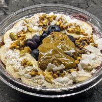 Acai, pistachio butter, banana and plant milk blended together, topped with blueberries, pistachio butter, coconut, banana and pistachio granola at Juice Generation - FiDi in New York City